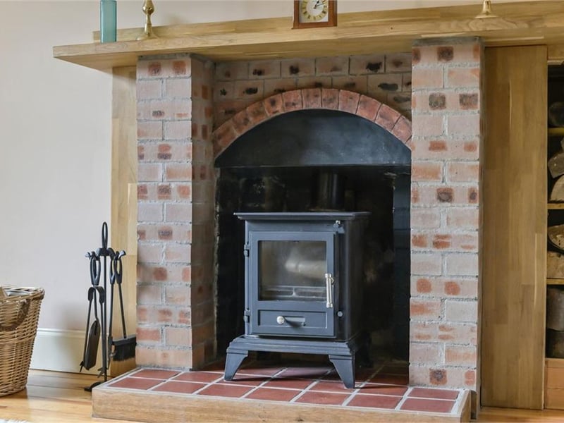Wood burning stove in living room.