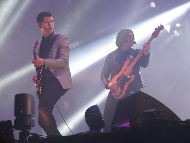 Alex Turner, left, and Nick O'Malley of the Arctic Monkeys performing on the Pyramid Stage at Glastonbury 2013