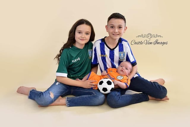 Sylvie and Rudi with little brother Rémy who is wearing his brother's first ever kit.