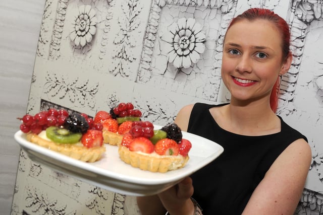 Supervisor Zoe Calder holds up some fruit tarts at Caffe Massarella, Meadowhall. Picture: Andrew Roe