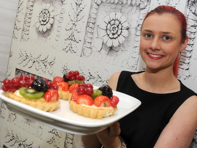 Supervisor Zoe Calder holds up some fruit tarts at Caffe Massarella, Meadowhall. Picture: Andrew Roe