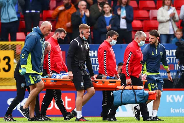 Callum Paterson of Sheffield Wednesday is stretchered off the pitch after picking up an injury during the Sky Bet League One match between Charlton Athletic and Sheffield Wednesday at The Valley on August 07, 2021 in London, England. (Photo by Jacques Feeney/Getty Images)