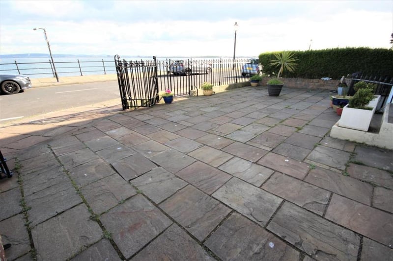There is a paved patio area with matching driveway.