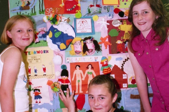 Elizabeth Grant, Elsa Ingledew and Jessica Taylor, pupils of Bankwood School, Sheffield, with the Millennium tapestry they have helped to create, July 22, 1999
