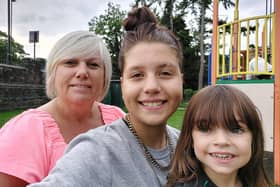 Pictured is single mum Angela Heath, of Wisewood, Sheffield, and her daughters Georgia and Molly, who have all been struggling after Ms Heath's Working Tax Credits were stopped when she applied for Tax-Free Childcare.