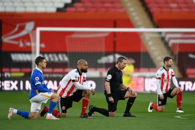 David McGoldrick took the knee before kick-off against Brighton, a game in which he scored the winner  (Photo by MICHAEL REGAN/POOL/AFP via Getty Images)