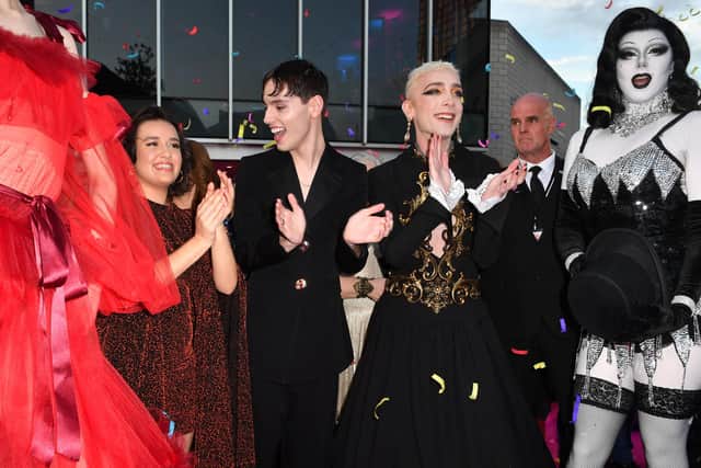 SHEFFIELD, ENGLAND - SEPTEMBER 17: Lauren Patel, Max Harwood and Jamie Campbell watch a perfomance on the red carpet during the "Everybody's Talking About Jamie" Sheffield Premiere at The Crucible Theatre on September 17, 2021 in Sheffield, England. (Photo by Anthony Devlin/Getty Images)