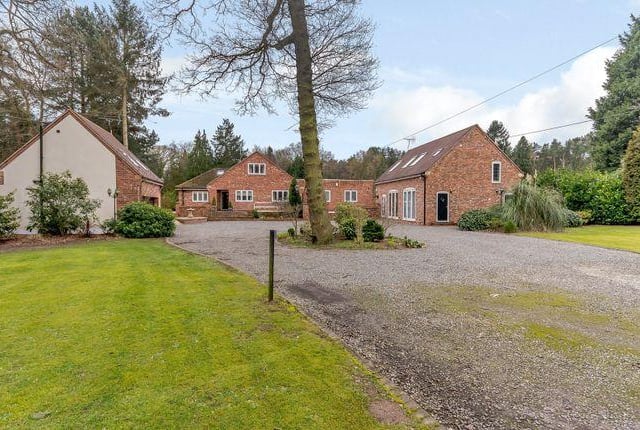 This four bedroom house has a two storey annexe and an indoor pool.