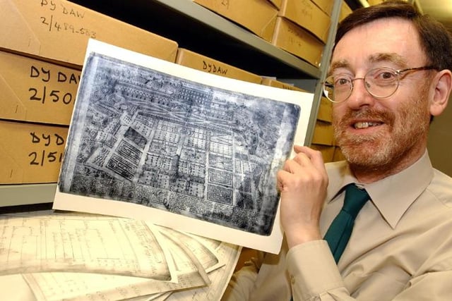 Dr Brian Barber, archivist holding an engraving which belonged to Samuel Pepys. Taken 2004.