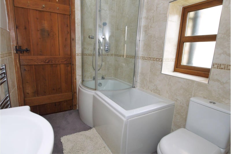 There is a heated towel rail, tiled walls and double glazed window.