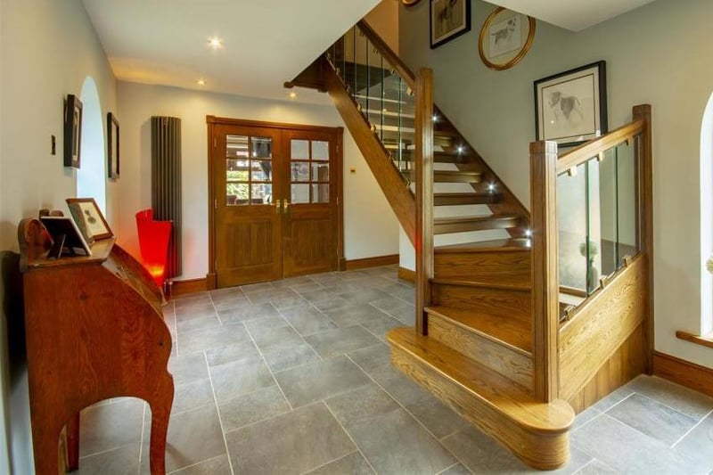 This entrance hallway gives you the perfect welcome to the property. With tiled flooring and a window to the side, it boasts an oak staircase leading to the first floor.