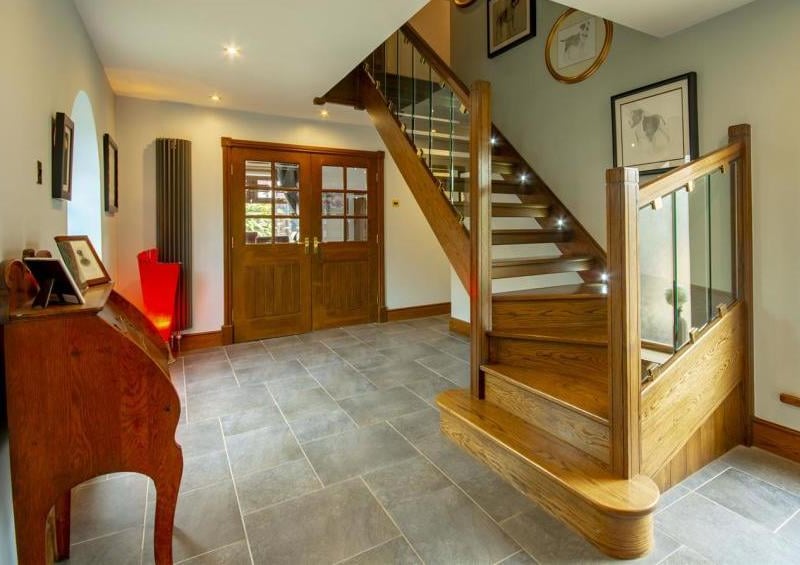 This entrance hallway gives you the perfect welcome to the property. With tiled flooring and a window to the side, it boasts an oak staircase leading to the first floor.