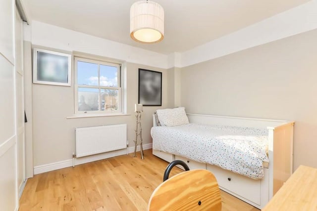 The third bedroom is described as three-quarter-sized, but it is cosy and sweet, with a carpeted floor and double-glazed window facing the back of the house.