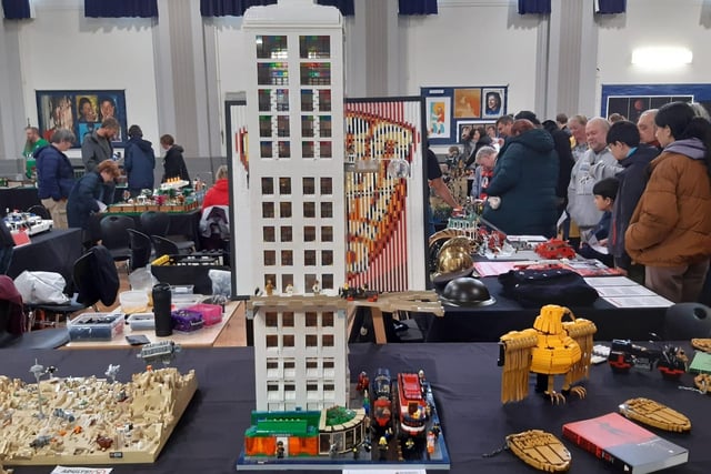 This tall building towered above the surrounding displays. At the bottom, there was a little hairdressers with Lego hair pieces displayed on the shelves.