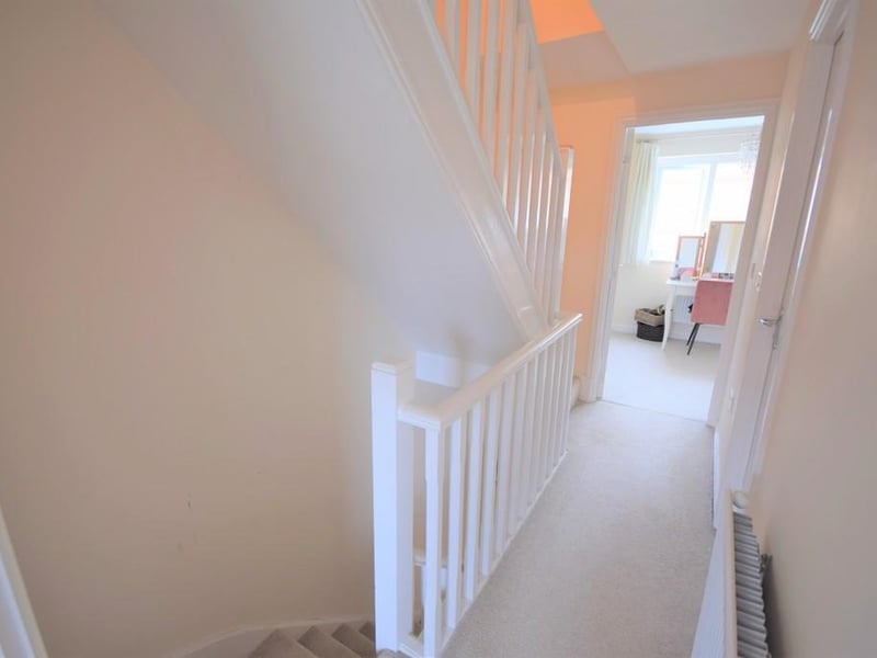 Having internal doors to two of the bedrooms, bathroom and stairs rising to the main bedroom.