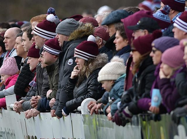 Supporters watch on at Mariners Park.
