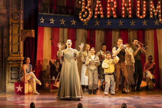 Monique Young as Charity and the cast of Barnum
