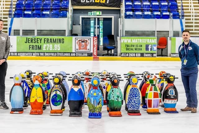 The newly decorated waddle of penguins at iceSheffield with David Bly, sports programme and engagement manager at SCT and Ryan Ruddiforth, programme supervisor at  iceSheffield, SCT