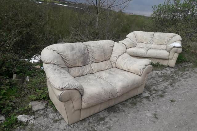 Van loads of rubbish have been left at the site, including this sofa.