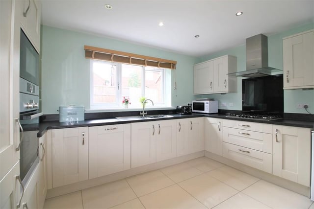 The  modern kitchen  contains Bosch appliances, built-in fridge freezer, integrated dishwasher, oven and microwave.
