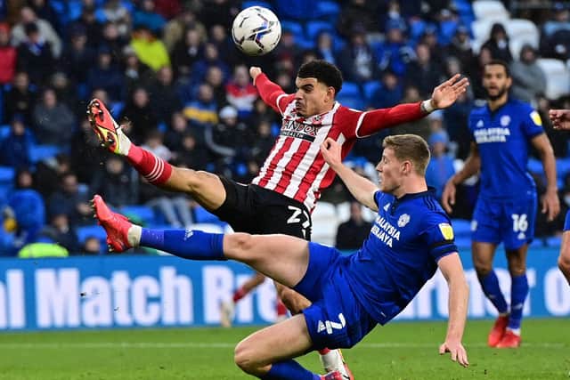 Mark McGuinness of Cardiff City challenges Morgan Gibbs-White of Sheffield United during last weekend's match in the Welsh capital: Ashley Crowden / Sportimage