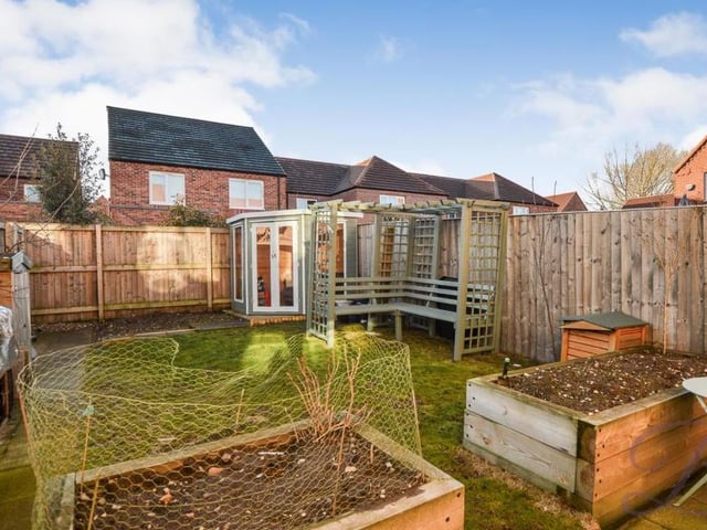 Another view of the back garden, which has a degree of privacy, thanks to a surrounding fence.