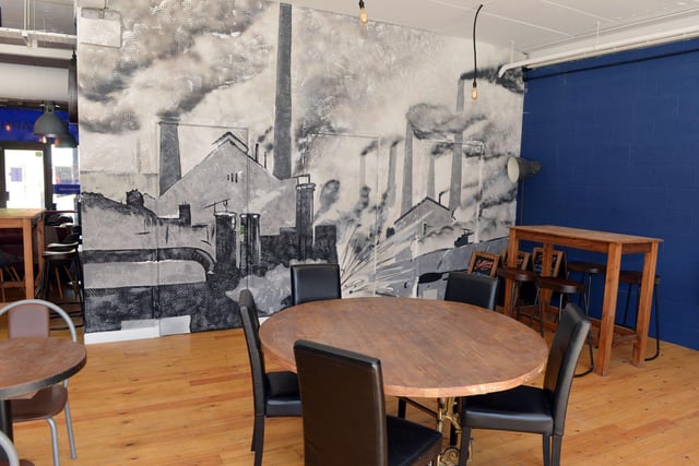 Sheffield-based artist Chris Ashmore has painted a large mural depicting scenes from old industrial Kelham, when the district was populated by metalworking factories and solo ‘little mesters’ plying their trade.