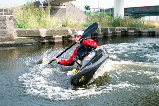 David Delaney from Kimberworth a member of Sheffield Canoe Club does a Seal launch into the Sheffield Canal from the Bridge alongside the Sheffield Arena in 1999