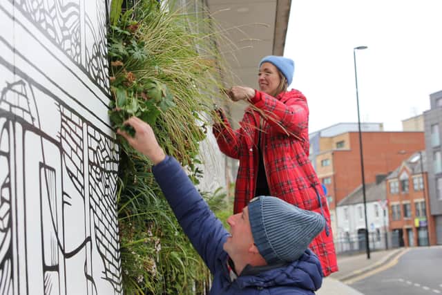 Jo Peel and Nigel Dunnett maintaining the Growing City mural in April.