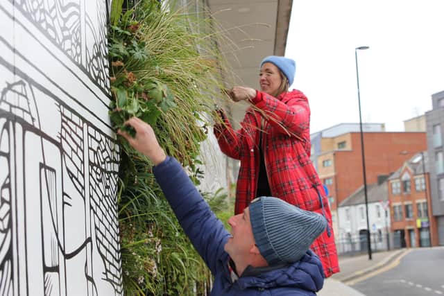 Jo Peel and Nigel Dunnett maintaining the Growing City mural in April.