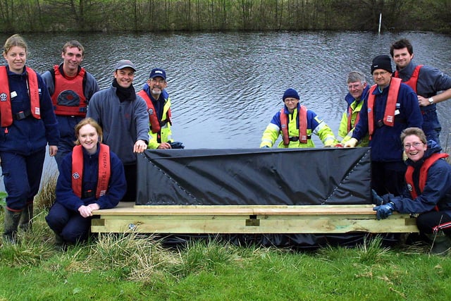 Park Rangers and volunteer rangers from Carsington Water prepare to launch the new otter holt in 2006