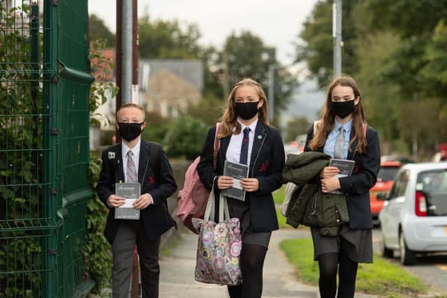 Pupils wearing facemasks as a precaution against the transmission of the novel coronavirus (Photo by OLI SCARFF / AFP) (Photo by OLI SCARFF/AFP via Getty Images)