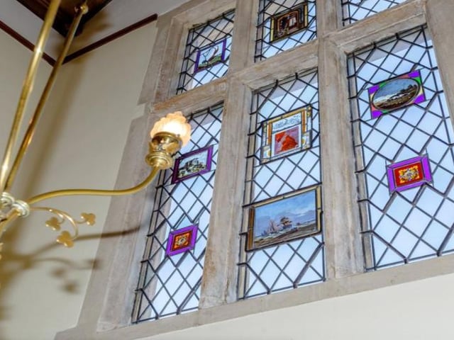 While most of the windows are now double glazing, so the property can offer comfortable modern living, some of the stained glass windows remain.