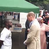 Prince Williams talks to Osei Gabriel Gyansah, who was helped by Reach Up Youth when he was facing homelessness, during his visit to Sheffield