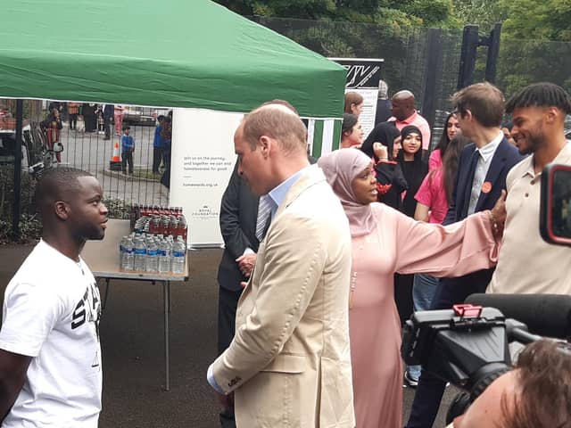 Prince Williams talks to Osei Gabriel Gyansah, who was helped by Reach Up Youth when he was facing homelessness, during his visit to Sheffield