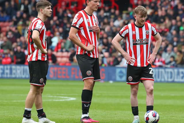 James McAtee and Tommy Doyle with their Sheffield United team mate Sander Berge: Simon Bellis / Sportimage