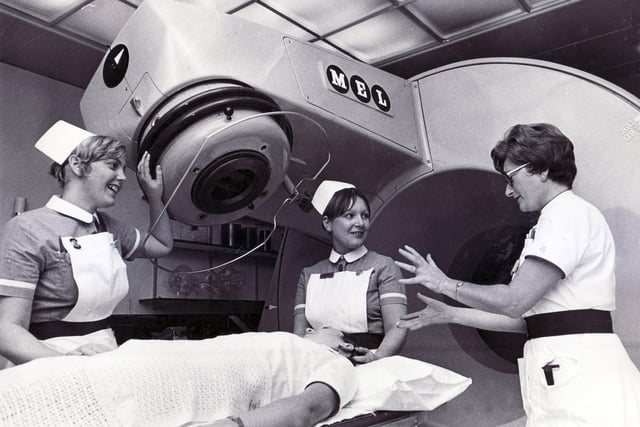Pictured preparing a patient for the five-million-volt linear accelerator at Weston Park Hospital, Sheffield in 1971 are enrolled nurses Nancy Oxlade, left, and Maureen O'Grady.  On the right is superintendent radiographer, Mary Bradley