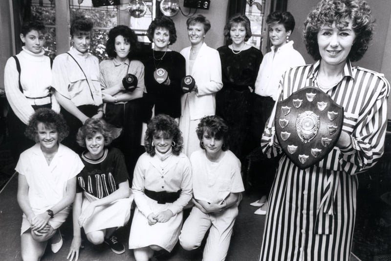 Members of the Sheffield Open Netball Club with, right, team coach Linda Marsden with the Coach's Player of the Year award won by Clare Sepple, June 10, 1988