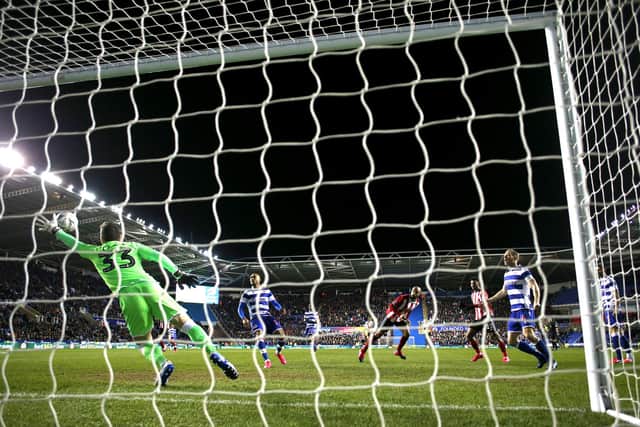 READING, ENGLAND - MARCH 03: David McGoldrick scores the opening goal of the  FA Cup Fifth Round match between Reading FC and Sheffield United at Madejski Stadium: Michael Steele/Getty Images
