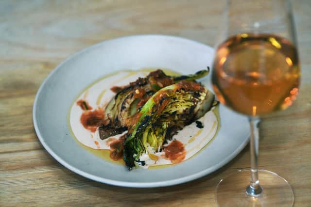 Tonco and The Orange Bird in Sheffield have both been named in The Good Food Guide's list of Britain's 100 best local restaurants. Pictured is a dish at Tonco of January King cabbage with hazelnut and fermented chilli dressing. Photo: Jonathan Gawthorpe