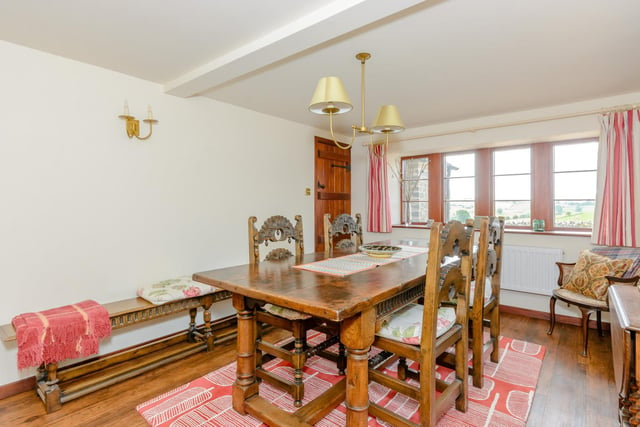 The ground floor also includes a dining room with wooden floors.