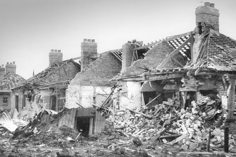 The relentless raids were still continuing in December 1941 and this photo shows aged people cottages which were partly demolished.