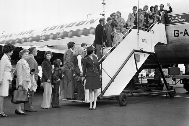 The first customers for Cosmos package holiday flights from Edinburgh board the DAN-AIR plane in May 1976.