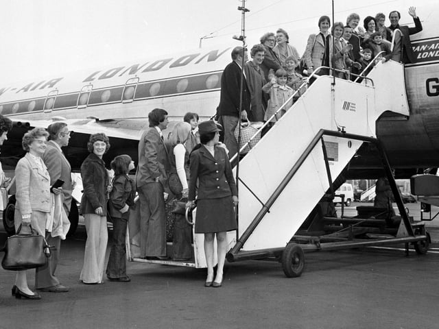 The first customers for Cosmos package holiday flights from Edinburgh board the DAN-AIR plane in May 1976.