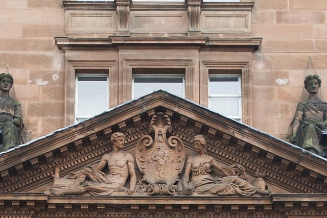 On which famous red sandstone landmark can you find these elaborate sculptures?