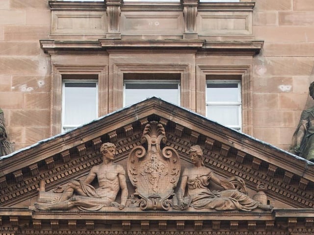 On which famous red sandstone landmark can you find these elaborate sculptures?