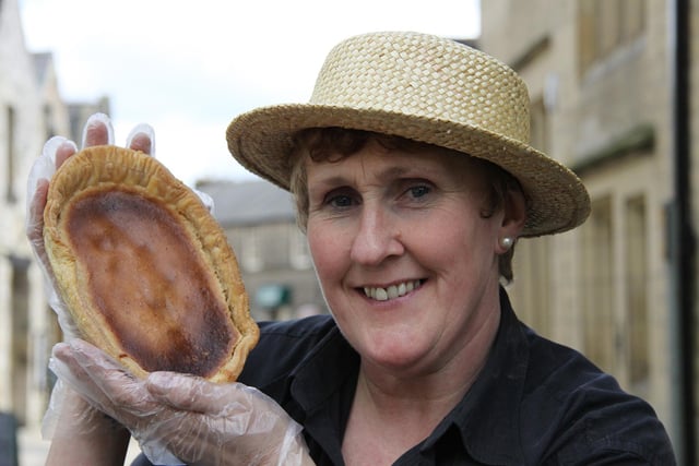 The Old Original Bakewell Pudding Shop assistant Diane Fox with one of the famous Bakewell puddings in 2012