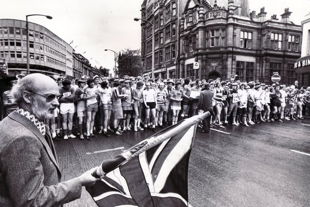 Star editor Colin Brannigan flags off the 1977 Jubilee Star Walk in High Street, Sheffield on June 7