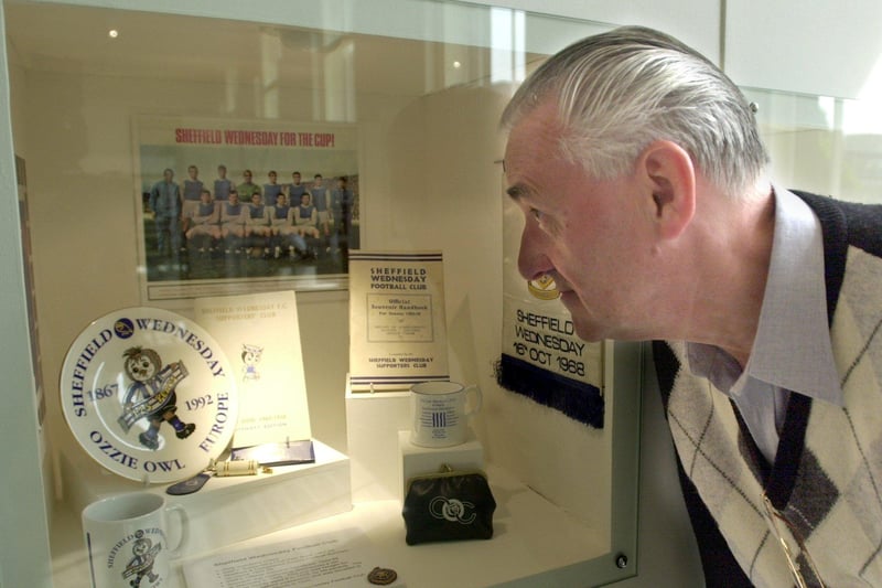 A Weston Park museum exhibition celebrating Stuart Clarke's book Homes of Football. Some of the Sheffield Wednesday memorabilia on show catches the eye of John Richmond of Sandygate, Sheffield in May 2001