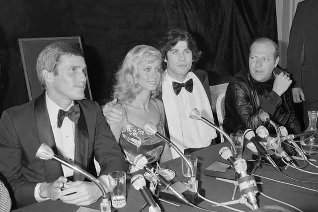 John Travolta and Olivia Newton-John at the Festival du Cinéma Américain in Deauville, France on September 9 1978 for a presentation of Grease (Photo by MYCHELE DANIAU/AFP via Getty Images)